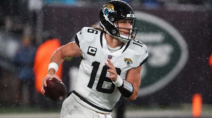 Dec 22, 2022; East Rutherford, New Jersey, USA; Jacksonville Jaguars quarterback Trevor Lawrence (16) runs with the ball against the New York Jets during the first half at MetLife Stadium.